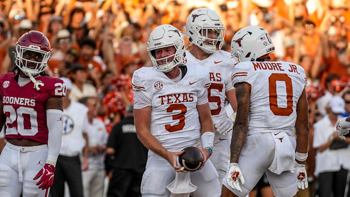 Texas Longhorns quarterback Quinn Ewers (3) celebrates a touchdown run during the Red River Rivalry game against Oklahoma at the Cotton Bowl on Saturday, Oct. 12, 2024 in Dallas, Texas.