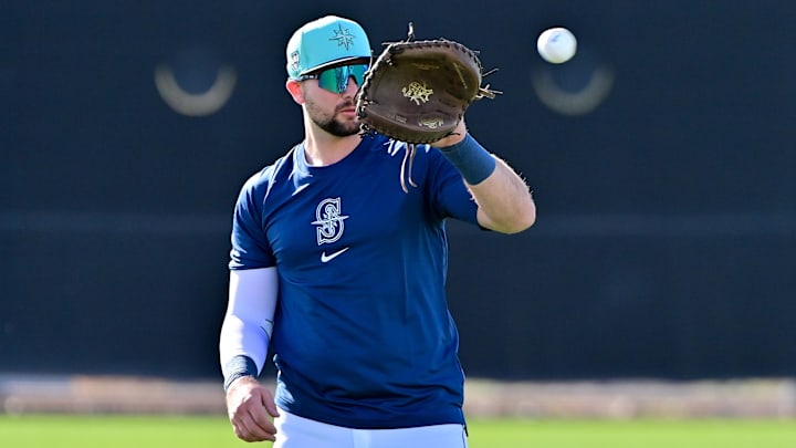 Feb 15, 2024; Peoria, AZ, USA; Seattle Mariners catcher Cal Raleigh (29) catches a ball during a Spring Training workout at Peoria Sports Complex. Mandatory Credit: Matt Kartozian-Imagn Images Feb 15, 2024; Peoria, AZ, USA; Seattle Mariners catcher Cal Raleigh (29) catches a ball during a Spring Training workout at Peoria Sports Complex. Mandatory Credit: Matt Kartozian-Imagn Images