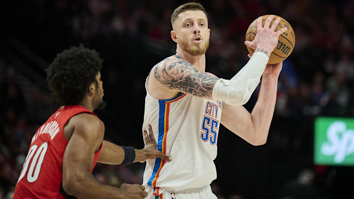 Jan 26, 2025; Portland, Oregon, USA; Oklahoma City Thunder center Isaiah Hartenstein (55) looks to pass the ball during the second half against Portland Trail Blazers guard Scoot Henderson (00) at Moda Center. Mandatory Credit: Troy Wayrynen-Imagn Images