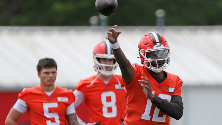 Browns quarterback Shedeur Sanders throws as QBs Dillon Gabriel (5) and Kenny Pickett look on during minicamp, Tuesday, June 10, 2025, in Berea.