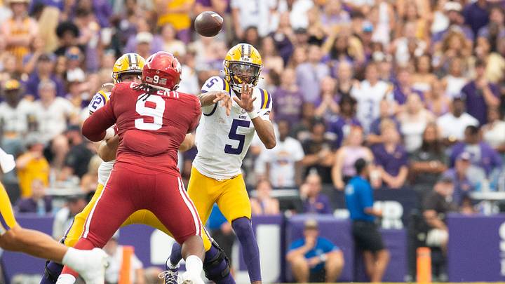 Sep 23, 2023; Baton Rouge, Louisiana, USA; LSU Tigers quarterback Jayden Daniels (5) throws a pass against the Arkansas Razorbacks at Tiger Stadium. Mandatory Credit: Scott Clause-Imagn Images Sep 23, 2023; Baton Rouge, Louisiana, USA; LSU Tigers quarterback Jayden Daniels (5) throws a pass against the Arkansas Razorbacks at Tiger Stadium. Mandatory Credit: Scott Clause-Imagn Images