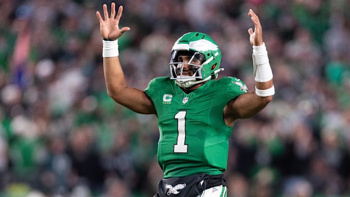 Nov 3, 2024; Philadelphia, Pennsylvania, USA; Philadelphia Eagles quarterback Jalen Hurts (1) reacts to Saquon Barkley (not pictured) touchdown run against the Jacksonville Jaguars during the second quarter at Lincoln Financial Field. Mandatory Credit: Bill Streicher-Imagn Images