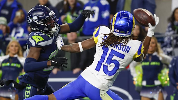 Nov 3, 2024; Seattle, Washington, USA; Los Angeles Rams wide receiver Demarcus Robinson (15) catches a game-winning touchdown pass against Seattle Seahawks cornerback Riq Woolen (27) during overtime at Lumen Field. Mandatory Credit: Joe Nicholson-Imagn Images Nov 3, 2024; Seattle, Washington, USA; Los Angeles Rams wide receiver Demarcus Robinson (15) catches a game-winning touchdown pass against Seattle Seahawks cornerback Riq Woolen (27) during overtime at Lumen Field. Mandatory Credit: Joe Nicholson-Imagn Images