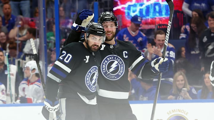 Dec 28, 2024; Tampa, Florida, USA; Tampa Bay Lightning left wing Nick Paul (20) celebrates with defenseman Victor Hedman (77) after he scored a goal against the New York Rangers during the third period at Amalie Arena. Mandatory Credit: Kim Klement Neitzel-Imagn Images