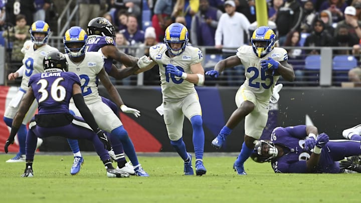 Jan 2, 2022; Baltimore, Maryland, USA; Los Angeles Rams running back Sony Michel (25) rushes as wide receiver Cooper Kupp (10) blocks Baltimore Ravens defensive back Khalil Dorsey (31)during the second half at M&T Bank Stadium. Mandatory Credit: Tommy Gilligan-Imagn Images Jan 2, 2022; Baltimore, Maryland, USA; Los Angeles Rams running back Sony Michel (25) rushes as wide receiver Cooper Kupp (10) blocks Baltimore Ravens defensive back Khalil Dorsey (31)during the second half at M&T Bank Stadium. Mandatory Credit: Tommy Gilligan-Imagn Images