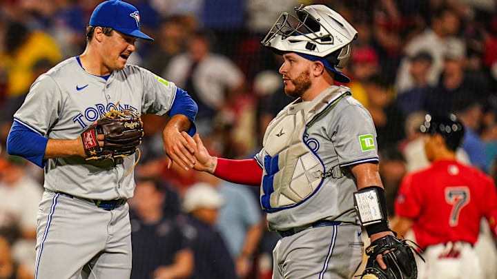 Aug 26, 2024; Boston, Massachusetts, USA; Toronto Blue Jays relief pitcher Brendon Little (54) reacts with catcher Alejandro Kirk (30) after striking out Boston Red Sox designated hitter Masataka Yoshida (7) to end the game in the nine innings at Fenway Park. Mandatory Credit: David Butler II-Imagn Images