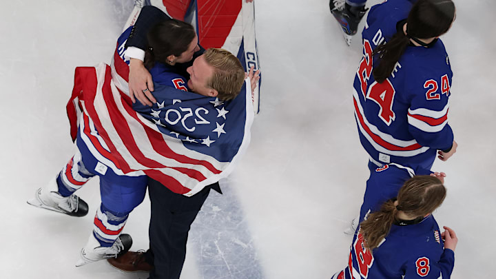 Megan Keller and USA coach John Wroblewski embrace after the gold medal game. Megan Keller and USA coach John Wroblewski embrace after the gold medal game.