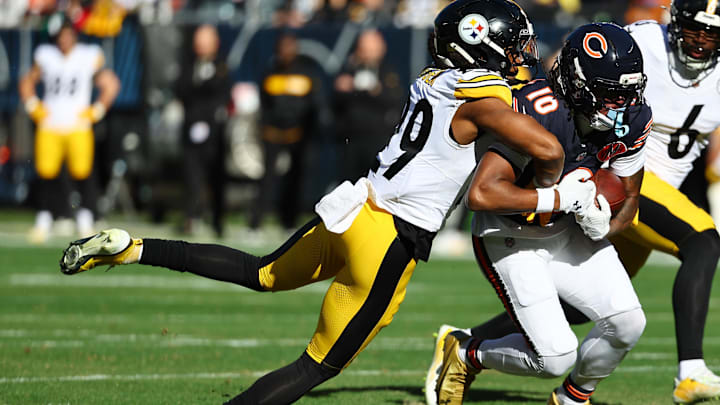 Nov 23, 2025; Chicago, Illinois, USA; Chicago Bears wide receiver Luther Burden III (10) makes a catch agsiasnt Pittsburgh Steelers safety Kyle Dugger (29) during the first half at Soldier Field. Mandatory Credit: Mike Dinovo-Imagn Images