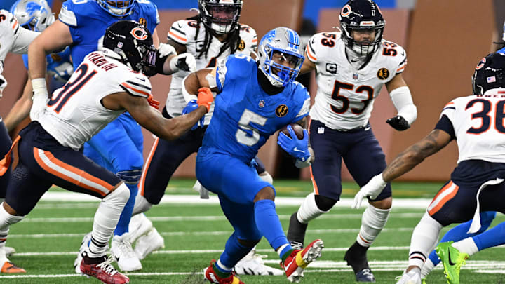 David Montgomery churns through the Bears defense in Thursday's loss at Detroit.