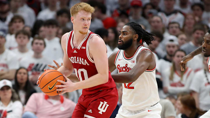 Indiana's Luke Goode (10) defended by Ohio State's Evan Mahaffey (12) at Value City Arena. 