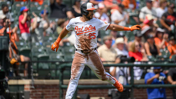 Jul 31, 2024; Baltimore, Maryland, USA; Baltimore Orioles outfielder Anthony Santander (25) scores a run against the Toronto Blue Jays during the first inning at Oriole Park at Camden Yards.