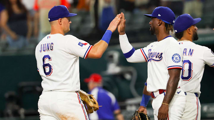 Texas Rangers third baseman Josh Jung (6) celebrates with Texas Rangers designated hitter Andrew McCutchen.