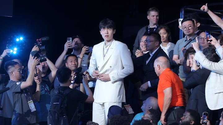 Jun 25, 2025; Brooklyn, NY, USA; Yang Hansen walks to the stage after being selected as the 16th pick by the Memphis Grizzlies in the first round of the 2025 NBA Draft at Barclays Center. Jun 25, 2025; Brooklyn, NY, USA; Yang Hansen walks to the stage after being selected as the 16th pick by the Memphis Grizzlies in the first round of the 2025 NBA Draft at Barclays Center.