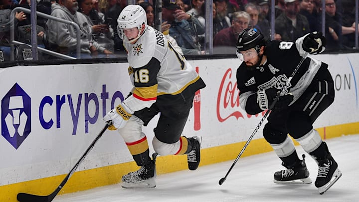 Feb 25, 2026; Los Angeles, California, USA; Vegas Golden Knights right wing Pavel Dorofeyev (16) moves the puck against Los Angeles Kings defenseman Drew Doughty (8) during the third period at Crypto.com Arena. Mandatory Credit: Gary A. Vasquez-Imagn Images