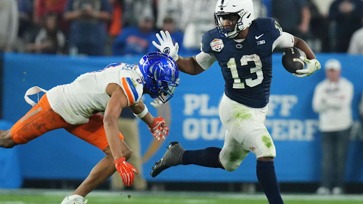 Penn State's Kaytron Allen tries to break by Boise State Broncos safety Ty Benefield.
