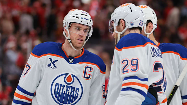 Nov 22, 2025; Sunrise, Florida, USA; Edmonton Oilers center Connor McDavid (97) speaks to center Leon Draisaitl (29) against the Florida Panthers during the second period at Amerant Bank Arena. Mandatory Credit: Sam Navarro-Imagn Images
