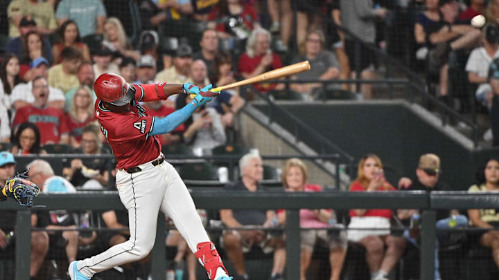 Apr 11, 2025; Phoenix, Arizona, USA; Arizona Diamondbacks shortstop Geraldo Perdomo (2) singles in the seventh inning against the Milwaukee Brewers at Chase Field. Mandatory Credit: Matt Kartozian-Imagn Images