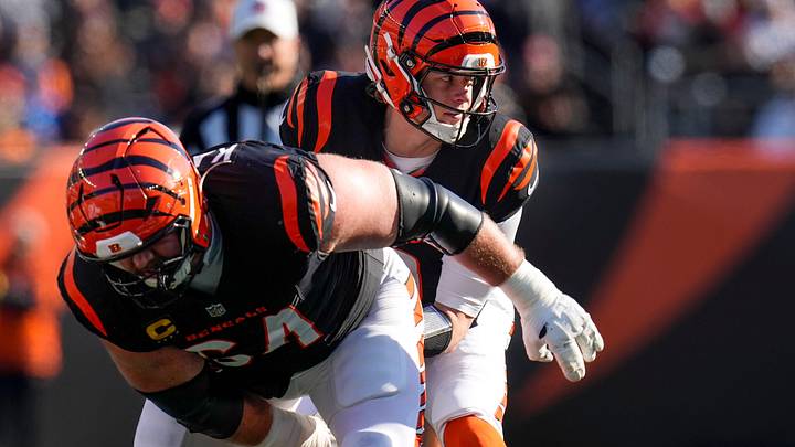 Jan 4, 2026; Cincinnati, Ohio, USA; Cincinnati Bengals quarterback Joe Burrow (9) takes a snap from center Ted Karras (64) in the first quarter against the Cleveland Browns  at Paycor Stadium. Mandatory Credit: Sam Greene-USA TODAY Network via Imagn Images
