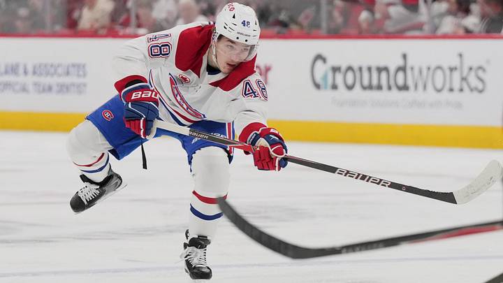 May 29, 2026; Raleigh, North Carolina, USA; Montreal Canadiens defenseman Lane Hutson (48) shoots the puck against the Carolina Hurricanes in game five of the Eastern Conference Final of the 2026 Stanley Cup Playoffs during the second period at Lenovo Center. Mandatory Credit: James Guillory-Imagn Images