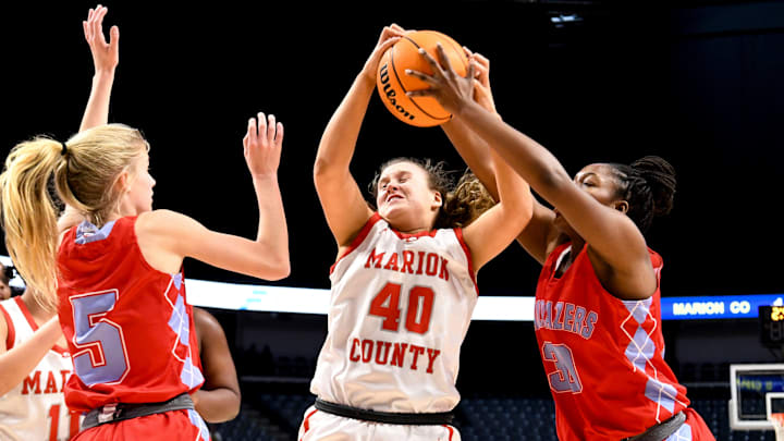 Marion County forward Erin Culp (40) and University Charter center Javionna Harrison (30) fight for a rebound during the state semifinal game Monday, Feb. 28, 2022, at Legacy Arena in Birmingham, Alabama.

University Charter Vs Marion County Ahsaa State Semifinal
