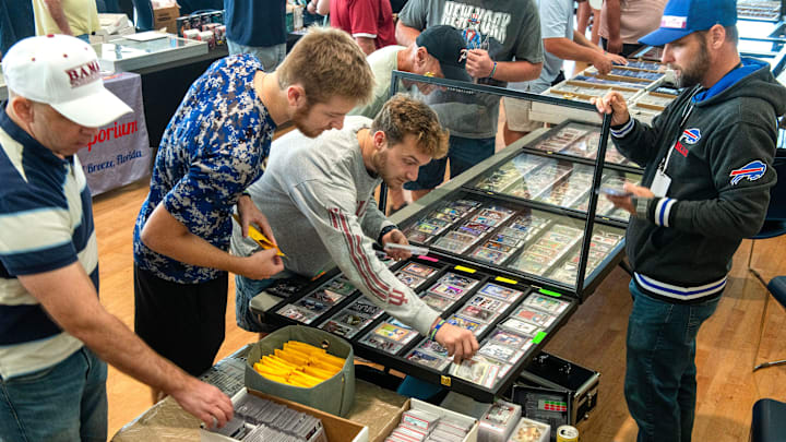 Card collectors check out the items for sale during Cards on the Coast Sports Card and TCG Show Saturday, Sept. 27, 2025 at Sanders Beach Corrine Jones Resource Center. 