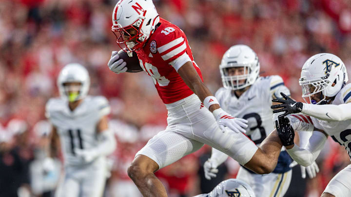 Nebraska wide receiver Quinn Clark hurdles Akron's Rodrick Hunter on his way to a 37-yard touchdown reception. Nebraska wide receiver Quinn Clark hurdles Akron's Rodrick Hunter on his way to a 37-yard touchdown reception.