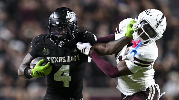 Oct 4, 2025; College Station, Texas, USA; Texas A&M Aggies running back Rueben Owens II (4) stiff arms Mississippi State Bulldogs safety Jahron Manning (13) during the fourth quarter at Kyle Field. Mandatory Credit: Maria Lysaker-Imagn Images Oct 4, 2025; College Station, Texas, USA; Texas A&M Aggies running back Rueben Owens II (4) stiff arms Mississippi State Bulldogs safety Jahron Manning (13) during the fourth quarter at Kyle Field. Mandatory Credit: Maria Lysaker-Imagn Images