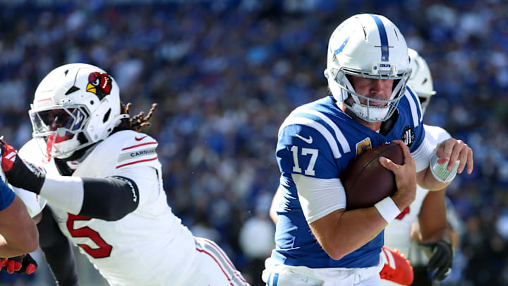 Oct 12, 2025; Indianapolis, Indiana, USA; Indianapolis Colts quarterback Daniel Jones (17) scrambles for a touchdown against the Arizona Cardinals during the second quarter of the game at Lucas Oil Stadium. Mandatory Credit: Trevor Ruszkowski-Imagn Images