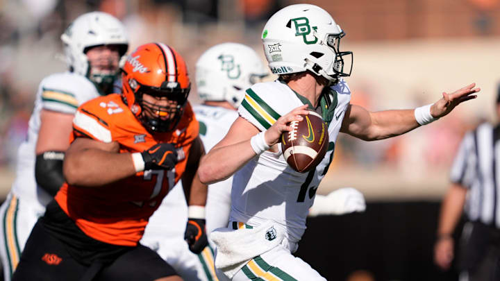 Baylor's Sawyer Robertson (13) looks to throw a pass in the second half of the college football game between the Oklahoma State Cowboys and the Baylor Bears at Boone Pickens Stadium in Stillwater, Okla., Saturday, Sept. 27, 2025.