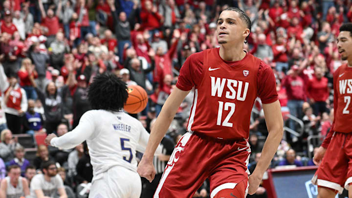 Mar 7, 2024; Pullman, Washington, USA; Washington State Cougars guard Isaiah Watts (12) celebrates after a dunk against the Washington Huskies in the first half at Friel Court at Beasley Coliseum. Mandatory Credit: James Snook-Imagn Images