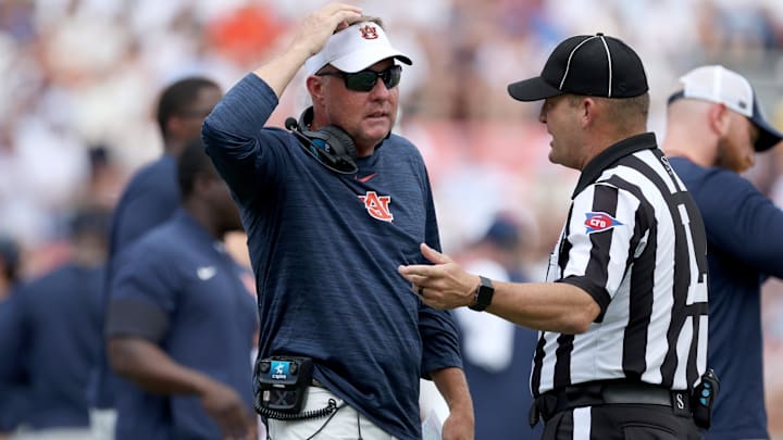 Sep 13, 2025; Auburn, Alabama, USA; Auburn Tigers head coach Hugh Freeze talks with a game official during the third quarter against the South Alabama Jaguars at Jordan-Hare Stadium. Mandatory Credit: John Reed-Imagn Images