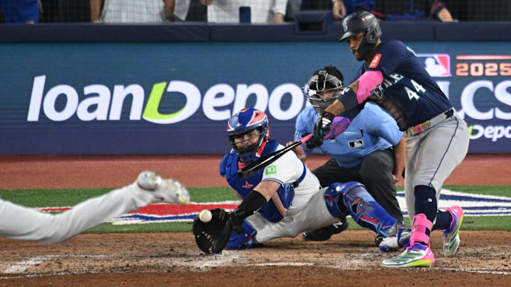 Oct 20, 2025; Toronto, Ontario, CAN; Seattle Mariners center fielder Julio Rodriguez (44) strikes out in front of Toronto Blue Jays catcher Alejandro Kirk (30) in the ninth inning of game seven of the ALCS round for the 2025 MLB playoffs against the Seattle Mariners at Rogers Centre. Mandatory Credit: Dan Hamilton-Imagn Images Oct 20, 2025; Toronto, Ontario, CAN; Seattle Mariners center fielder Julio Rodriguez (44) strikes out in front of Toronto Blue Jays catcher Alejandro Kirk (30) in the ninth inning of game seven of the ALCS round for the 2025 MLB playoffs against the Seattle Mariners at Rogers Centre. Mandatory Credit: Dan Hamilton-Imagn Images