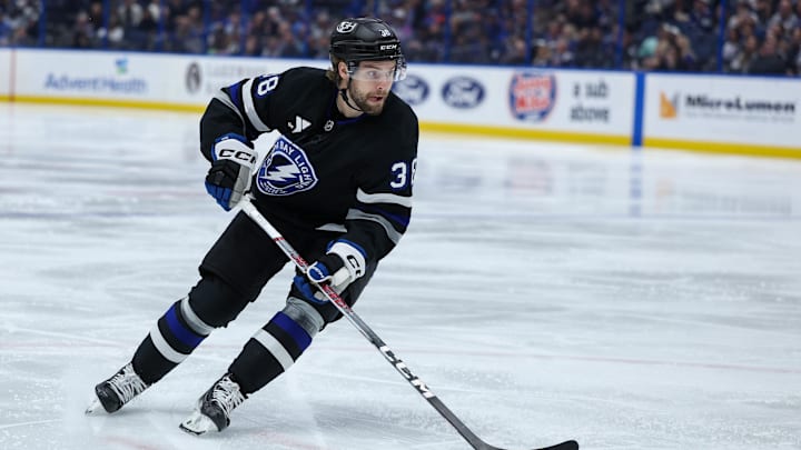 Feb 1, 2025; Tampa, Florida, USA; Tampa Bay Lightning left wing Brandon Hagel (38) controls the puck against the New York Islanders in the second period at Amalie Arena. Mandatory Credit: Nathan Ray Seebeck-Imagn Images Feb 1, 2025; Tampa, Florida, USA; Tampa Bay Lightning left wing Brandon Hagel (38) controls the puck against the New York Islanders in the second period at Amalie Arena. Mandatory Credit: Nathan Ray Seebeck-Imagn Images