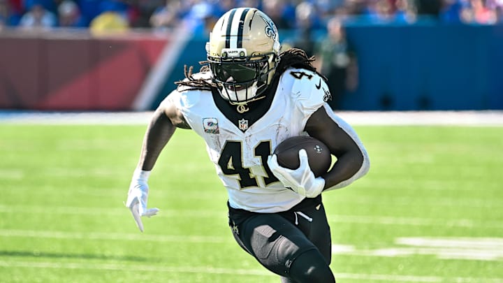 Sep 28, 2025; Orchard Park, New York, USA; New Orleans Saints running back Alvin Kamara (41) carries the ball against the Buffalo Bills in the third quarter at Highmark Stadium. Mandatory Credit: Mark Konezny-Imagn Images