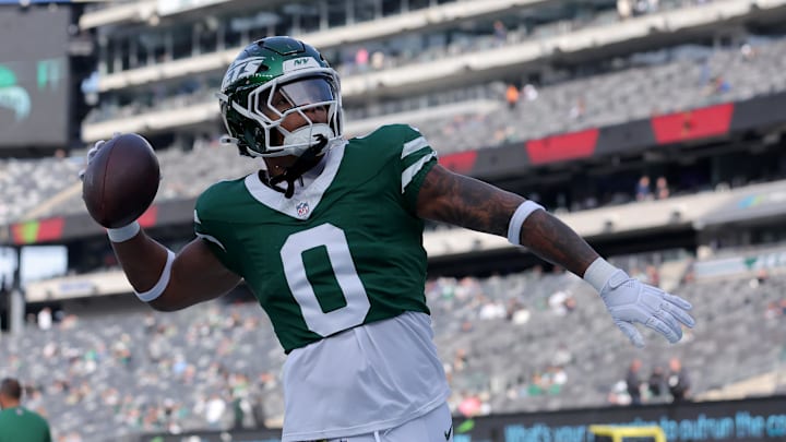New York Jets running back Braelon Allen (0) plays catch with fans before a game against the Indianapolis Colts at MetLife Stadium. New York Jets running back Braelon Allen (0) plays catch with fans before a game against the Indianapolis Colts at MetLife Stadium.