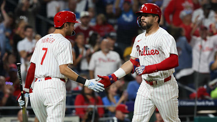 Sep 9, 2024; Philadelphia, Pennsylvania, USA; Philadelphia Phillies designated hitter Kyle Schwarber (12) shakes hands with shortstop Trea Turner (7) after hitting a solo home run during the sixth inning against the Tampa Bay Rays at Citizens Bank Park.