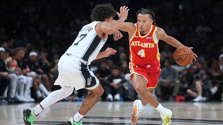 Oct 8, 2026; San Antonio, Texas, USA; Atlanta Hawks guard Kingston Flemings (4) looks to pass the ball while defended by San Antonio Spurs guard Ja'Kobi Gillespie (17) during the second half at Frost Bank Center. Oct 8, 2026; San Antonio, Texas, USA; Atlanta Hawks guard Kingston Flemings (4) looks to pass the ball while defended by San Antonio Spurs guard Ja'Kobi Gillespie (17) during the second half at Frost Bank Center.