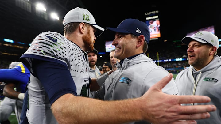 Dec 18, 2025; Seattle, Washington, USA; Seattle Seahawks head coach Mike MacDonald embraces quarterback Sam Darnold (14) after defeating the Los Angeles Rams in overtime at Lumen Field. Mandatory Credit: Kevin Ng-Imagn Images Dec 18, 2025; Seattle, Washington, USA; Seattle Seahawks head coach Mike MacDonald embraces quarterback Sam Darnold (14) after defeating the Los Angeles Rams in overtime at Lumen Field. Mandatory Credit: Kevin Ng-Imagn Images