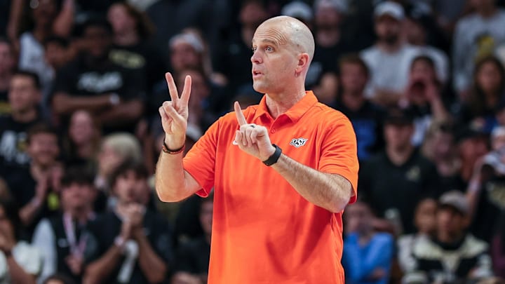 Mar 5, 2025; Orlando, Florida, USA; Oklahoma State Cowboys head coach Steve Lutz motions to the court during the first half against the UCF Knights at Addition Financial Arena. Mandatory Credit: Mike Watters-Imagn Images