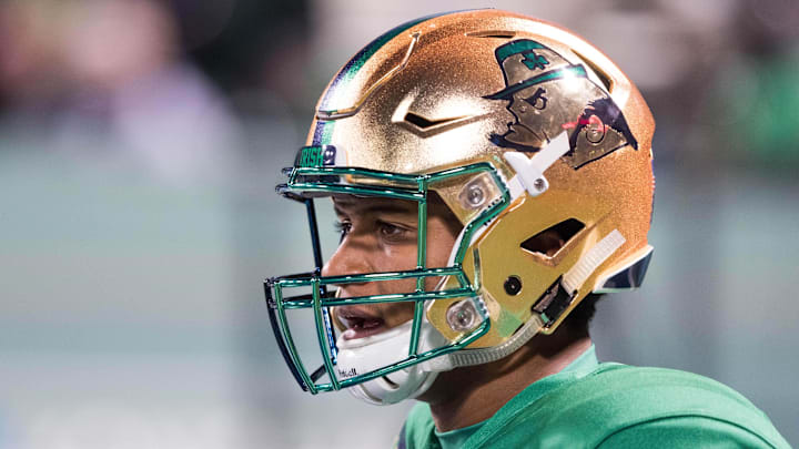 Nov 21, 2015; Boston, MA, USA; Notre Dame Fighting Irish quarterback DeShone Kizer (14) wears the special edition Shamrock Series helmet during warmups for the game against the Boston College Eagles at Fenway Park. 