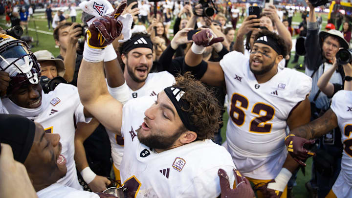 Arizona State Sun Devils running back Cam Skattebo (4) celebrates after defeating the Arizona Wildcats during the Territorial Cup at Arizona Stadium. 
