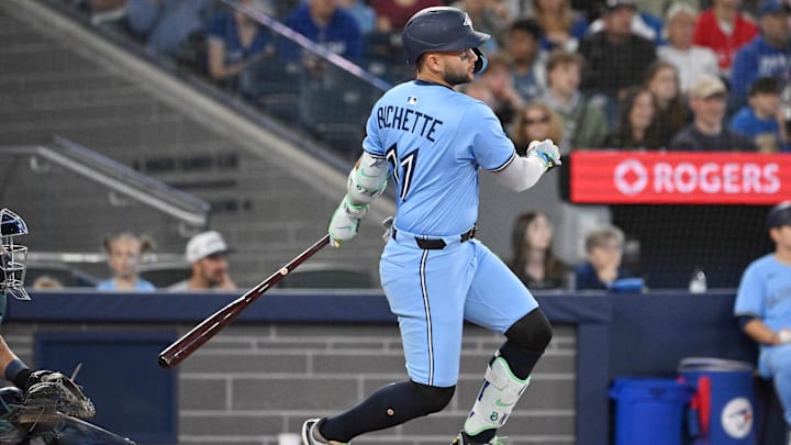 Apr 20, 2025; Toronto, Ontario, CAN;  Toronto Blue Jays shortstop Bo Bichette (11) hits an RBI single against the Seattle Mariners in the third inning at Rogers Centre. 
