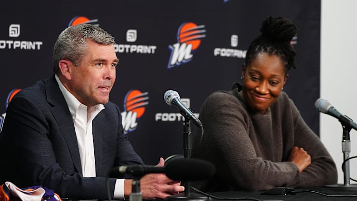 Feb 10, 2022; Phoenix, Arizona, USA; Phoenix Mercury general manager Jim Pitman (left) speaks about his new player, Tina Charles, at an introductory press conference at Footprint Center. Mandatory Credit: Patrick Breen-The Republic