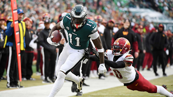 Jan 26, 2025; Philadelphia, PA, USA; Philadelphia Eagles wide receiver A.J. Brown (11) runs with the ball against Washington Commanders cornerback Mike Sainristil (0) during the first half in the NFC Championship game at Lincoln Financial Field. Mandatory Credit: Eric Hartline-Imagn Images