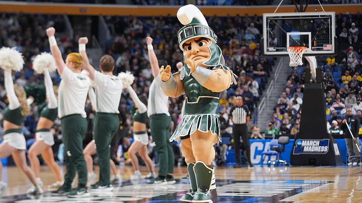 Mar 21, 2026; Buffalo, NY, USA; Michigan State Spartans mascot Sparty performs during a time out in the first half against the Louisville Cardinals during a second round game of the men's 2026 NCAA Tournament at Keybank Center. Mandatory Credit: Gregory Fisher-Imagn Images Mar 21, 2026; Buffalo, NY, USA; Michigan State Spartans mascot Sparty performs during a time out in the first half against the Louisville Cardinals during a second round game of the men's 2026 NCAA Tournament at Keybank Center. Mandatory Credit: Gregory Fisher-Imagn Images