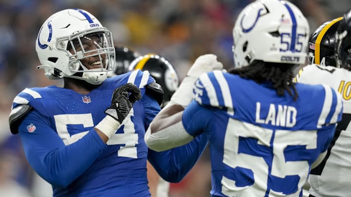 Sep 29, 2024; Indianapolis, Indiana, USA;  Indianapolis Colts defensive end Dayo Odeyingbo (54) and Indianapolis Colts defensive end Isaiah Land (55) celebrate a sack Sunday, Sept. 29, 2024, during a game against the Pittsburgh Steelers at Lucas Oil Stadium. Mandatory Credit: Grace Smith-USA TODAY Network via Imagn Images
