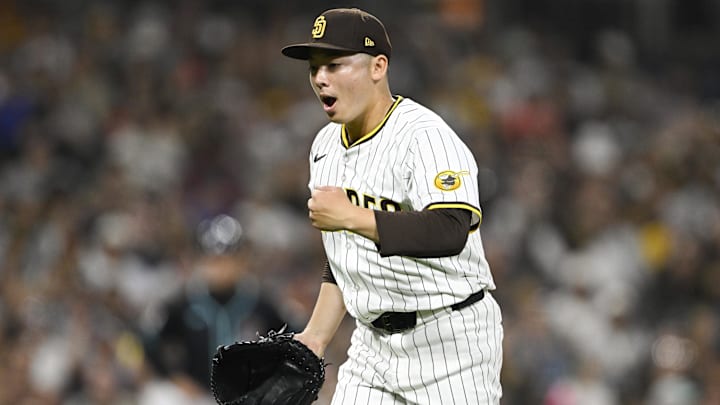 Sep 27, 2025; San Diego, California, USA; San Diego Padres relief pitcher Yuki Matsui (1) pumps his fist after pitching during the fourth inning against the Arizona Diamondbacks at Petco Park. Mandatory Credit: Denis Poroy-Imagn Images