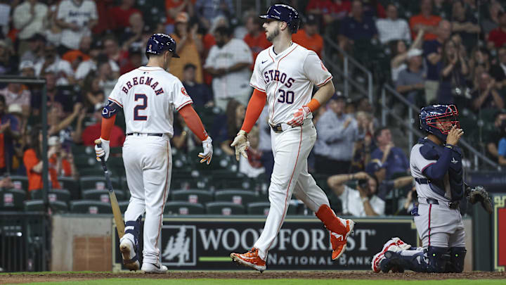 Apr 16, 2024; Houston, Texas, USA; Houston Astros right fielder Kyle Tucker (30) celebrates with third baseman Alex Bregman (2) after hitting a home run during the ninth inning against the Atlanta Braves at Minute Maid Park.