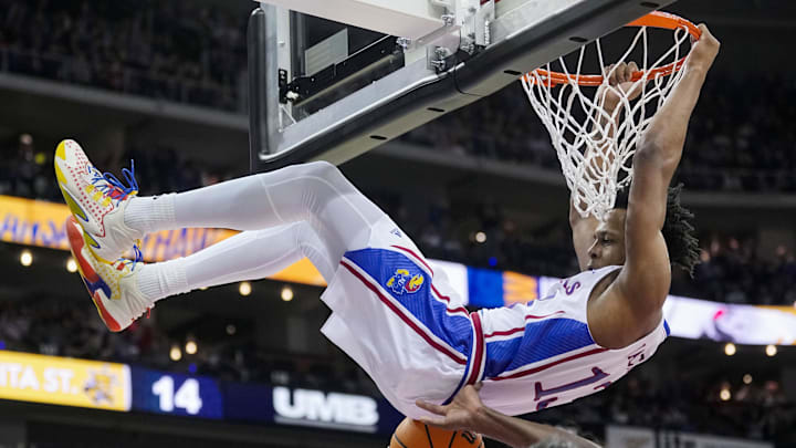 Dec 30, 2023; Kansas City, Missouri, USA; Kansas Jayhawks guard Elmarko Jackson (13) dunks against the Wichita State Shockers