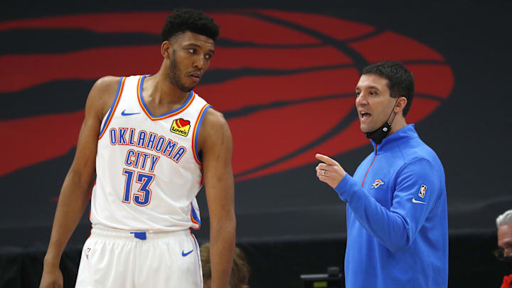 Apr 18, 2021; Tampa, Florida, USA; Oklahoma City Thunder head coach Mark Daigneault talks with center Tony Bradley (13) against the Toronto Raptors during the first half at Amalie Arena. Mandatory Credit: Kim Klement-Imagn Images Apr 18, 2021; Tampa, Florida, USA; Oklahoma City Thunder head coach Mark Daigneault talks with center Tony Bradley (13) against the Toronto Raptors during the first half at Amalie Arena. Mandatory Credit: Kim Klement-Imagn Images
